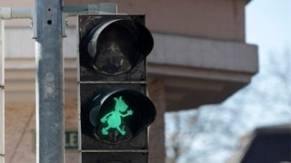 Pferdle als grünes Symbol an einer Fußgängerampel in Stuttgart