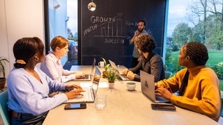 Diverse team collaborating in a meeting room