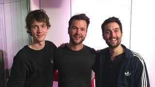 Henning May, SWR3-Moderator Sebastian Müller und Christopher Annen