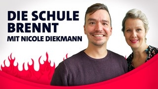 Nicole Diekmann und Bob Blume vor Flammen