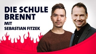 Sebastian Fitzek und Bob Blume vor Flammen