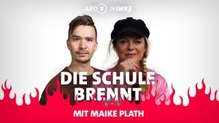 Bob Blume und Maike Plath vor Flammen