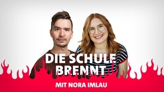 Bob Blume und Nora Imlau vor Flammen